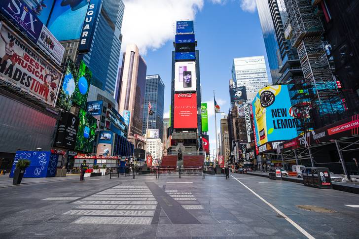An empty Times Square as billboards continue to display ads